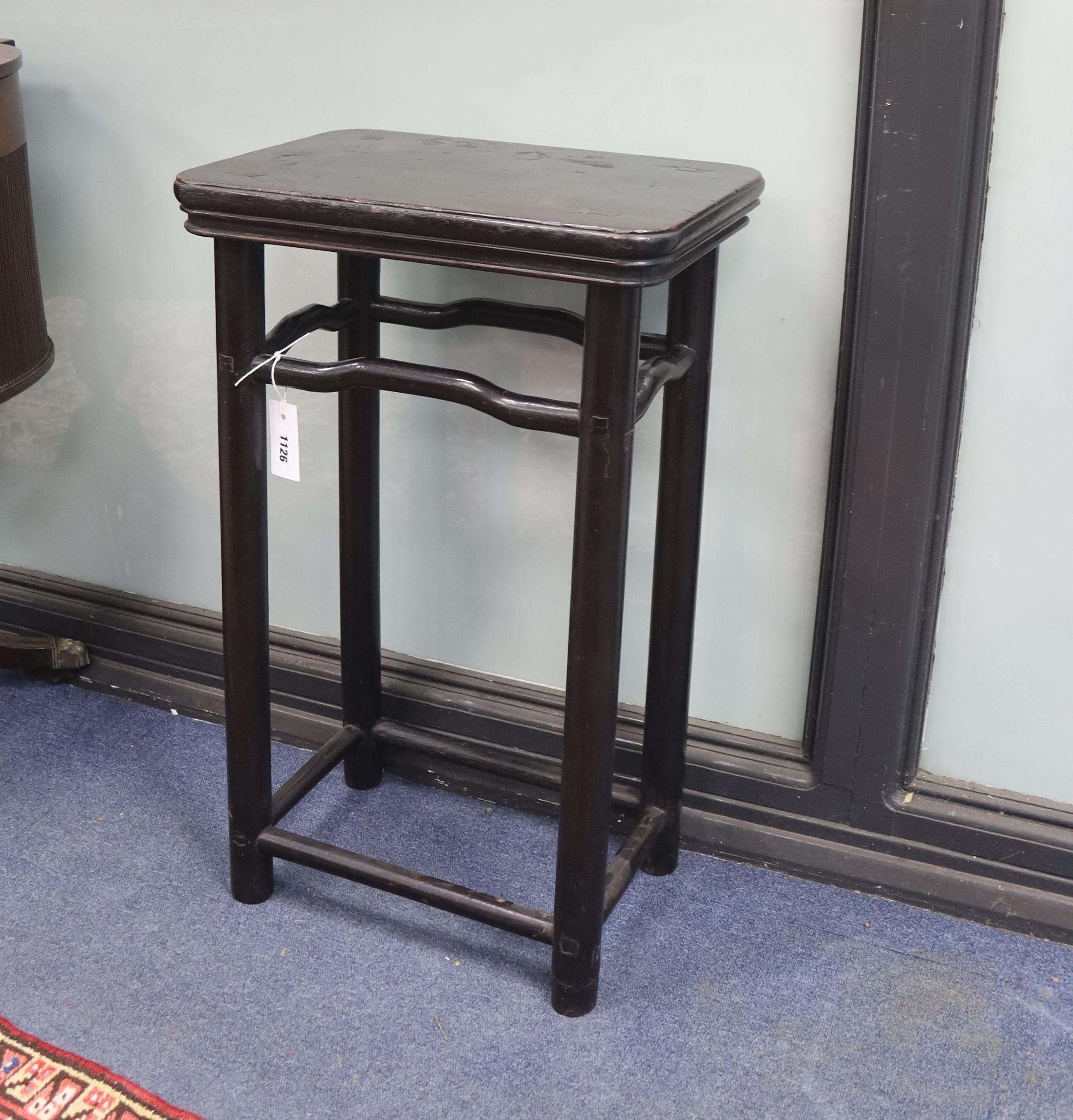 A Chinese rectangular lacquered stool, length 45cm, depth 31cm, height 73cm